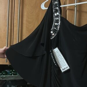 Brand Cachet.  Size 8.  Color black.  New with tags.  Soft material stretchable.